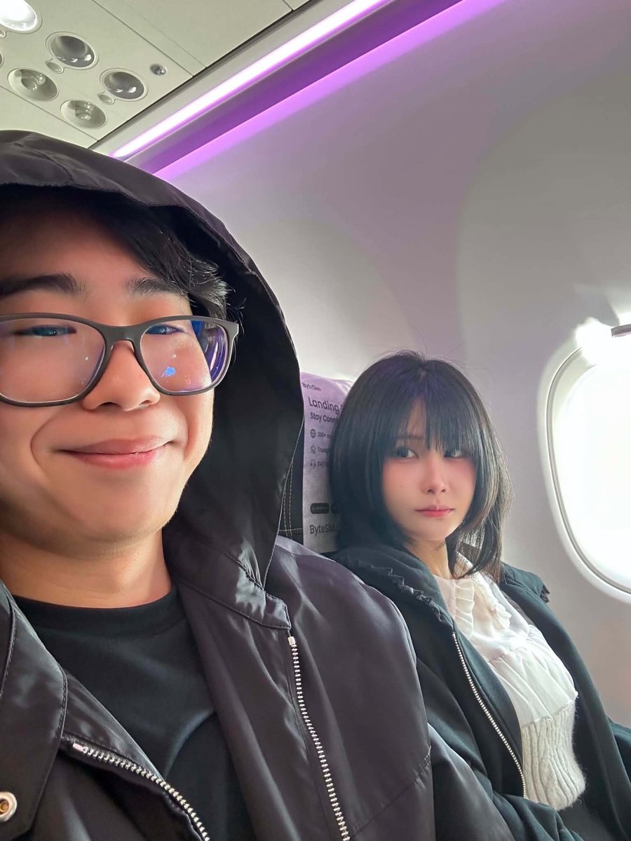 On an airplane together, Nana by the window