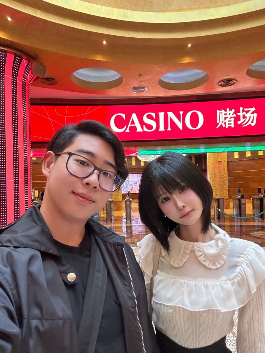 Standing in front of a casino sign