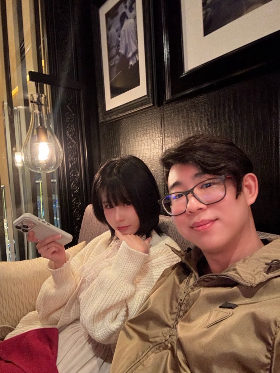 Sitting together in a dim lounge
